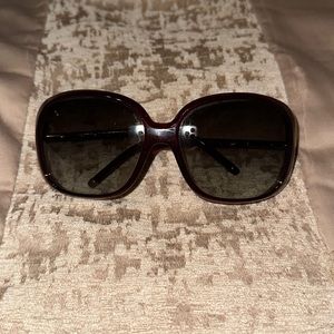 Burberry sunglasses. Color: dark burgundy.
